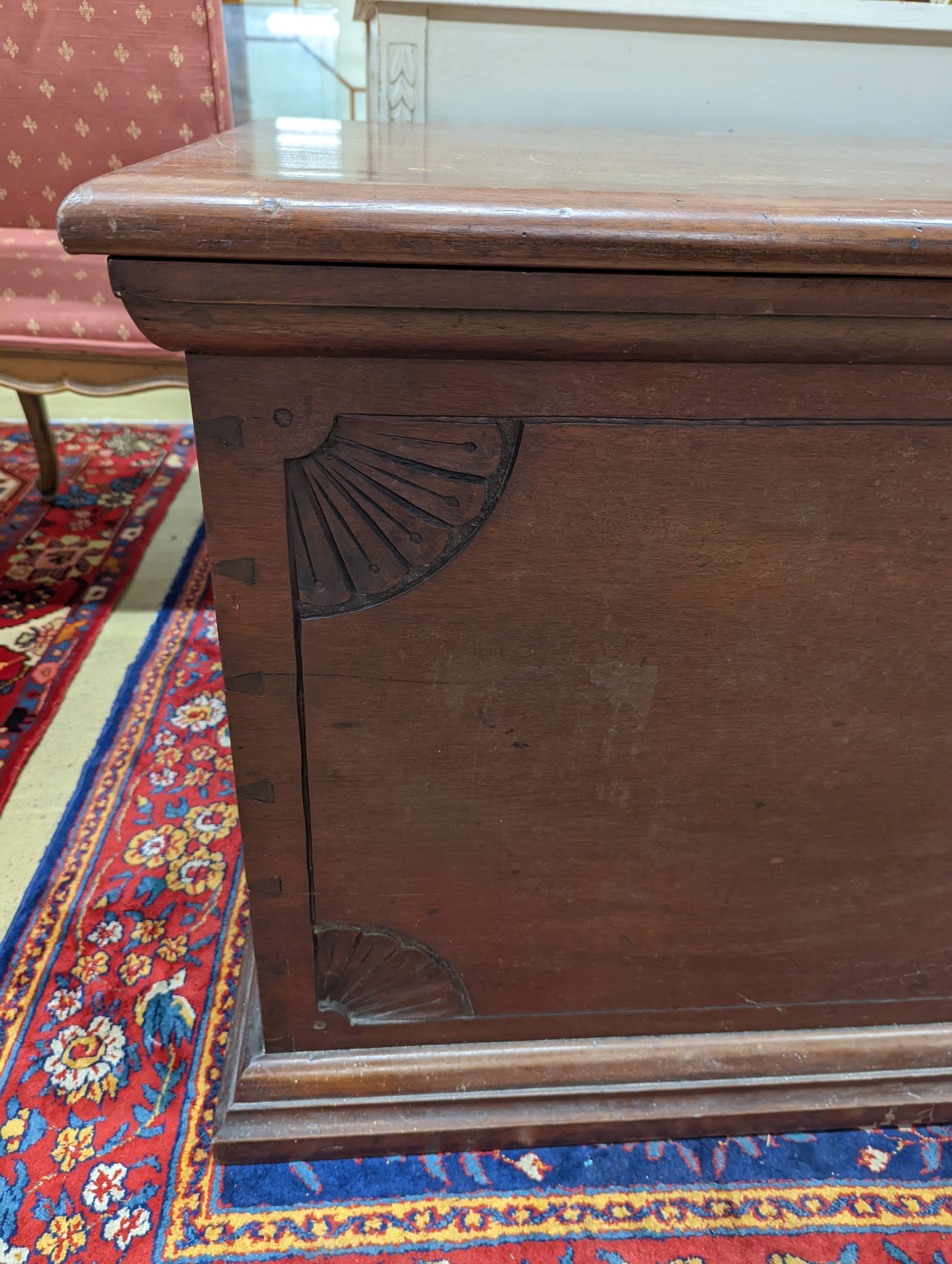 A large rectangular carved teak trunk, length 116cm, depth 58cm, height 64cm